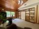 Living room featuring built-in bookshelves and a window offering backyard views at 5354 Ceva Dr, Hollywood, SC 29449