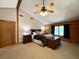 Cozy main bedroom featuring vaulted ceilings, wood beams and accents, with windows to let in natural light at 5354 Ceva Dr, Hollywood, SC 29449