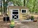 Charming outbuilding with a welcoming porch and decorative details, perfect for a studio or office at 5354 Ceva Dr, Hollywood, SC 29449