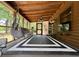Relaxing screened porch with a hammock chair, seating, and wooded views at 5354 Ceva Dr, Hollywood, SC 29449