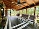 Inviting screened porch with ceiling fans, seating, and an outdoor lounging area at 5354 Ceva Dr, Hollywood, SC 29449