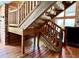Staircase with rustic wood railing and natural wood flooring at 5354 Ceva Dr, Hollywood, SC 29449