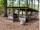 Convenient wood storage structure with ample space for firewood and equipment at 5354 Ceva Dr, Hollywood, SC 29449