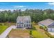 Aerial view of a home, lush landscaping, and neighborhood, highlighting its location and curb appeal at 5497 Alpine Dr, Summerville, SC 29483