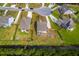 Aerial view of the property featuring well-maintained landscaping, backyard fire pit, and proximity to a natural water feature at 5497 Alpine Dr, Summerville, SC 29483