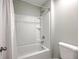 Clean bathroom showcasing a shower-tub combination with a white shower curtain and a standard toilet at 5497 Alpine Dr, Summerville, SC 29483