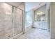 Bright bathroom featuring a glass enclosed shower, soaking tub, and double sink vanity at 5497 Alpine Dr, Summerville, SC 29483