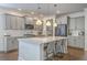 Well-equipped kitchen boasts stainless appliances, a spacious island, and pendant lighting at 5497 Alpine Dr, Summerville, SC 29483