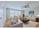 Spacious living room features light wood flooring and neutral furniture at 5497 Alpine Dr, Summerville, SC 29483