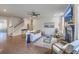Inviting living room features hardwood floors, fireplace, and comfortable seating at 5497 Alpine Dr, Summerville, SC 29483