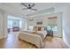 This primary bedroom offers a tray ceiling, laminate floors, and an open sitting area at 5497 Alpine Dr, Summerville, SC 29483
