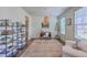 Stylish home office with custom shelving, a modern desk, and lots of natural light at 5497 Alpine Dr, Summerville, SC 29483
