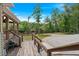 Outdoor deck with steps leading to backyard, river access, and natural wooded surroundings at 5653 Wire Rd, Branchville, SC 29432