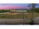 Waterfront home with scenic views, a spacious porch, and charming outdoor amenities at 5653 Wire Rd, Branchville, SC 29432