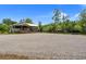 Inviting waterfront home with ample parking and a covered porch, set against lush greenery at 5653 Wire Rd, Branchville, SC 29432
