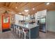 Modern kitchen with a large island, seating, and stainless steel appliances at 5653 Wire Rd, Branchville, SC 29432