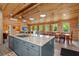 Open-concept kitchen with a large island, connecting seamlessly to the living and dining areas at 5653 Wire Rd, Branchville, SC 29432