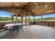 Covered patio with ceiling fan, table with chairs and scenic backyard views at 5653 Wire Rd, Branchville, SC 29432