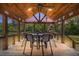 Inviting covered porch with dining area, ideal for entertaining at 5653 Wire Rd, Branchville, SC 29432