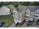 Overhead view of townhomes showing varied neutral exteriors, garages, and landscaped grounds at 5911 Steward St # 24, Hanahan, SC 29410