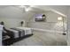 Bright, spacious bedroom features a ceiling fan, mounted television, and decorative wall accent at 5911 Steward St # 24, Hanahan, SC 29410