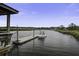 Waterfront home featuring a private boat dock and lift in a serene canal setting at 5911 Steward St # 24, Hanahan, SC 29410