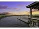 Picturesque waterfront view from a private dock at sunset with beautiful orange and blue skies at 5911 Steward St # 24, Hanahan, SC 29410