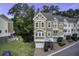 Charming townhome with two-car garage, brick driveway, and lush landscaping at 5911 Steward St # 24, Hanahan, SC 29410