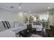 Spacious living room with hardwood floors, a ceiling fan, and an open floor plan at 5911 Steward St # 24, Hanahan, SC 29410