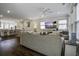 Bright, open-concept living area with hardwood floors and views of the dining area and kitchen at 5911 Steward St # 24, Hanahan, SC 29410
