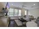 Comfortable living room with hardwood floors, large windows, and modern furnishings at 5911 Steward St # 24, Hanahan, SC 29410