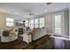 Inviting living room featuring hardwood floors, neutral paint, and abundant natural light at 5911 Steward St # 24, Hanahan, SC 29410