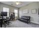 Comfortable office featuring desk, chair, love seat, and natural light at 5911 Steward St # 24, Hanahan, SC 29410