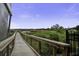 Enjoy a relaxing stroll on this serene wooden walkway through lush marshlands with railings at 5911 Steward St # 24, Hanahan, SC 29410