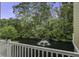 Balcony view overlooking a serene pond with a fountain, surrounded by lush green trees at 5911 Steward St # 24, Hanahan, SC 29410