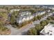 An aerial view of multi-story apartment buildings, trees, and city streets at 600 Bucksley Ln # 305, Charleston, SC 29492