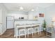 Kitchen featuring a breakfast bar with seating, white cabinets, and modern appliances at 600 Bucksley Ln # 305, Charleston, SC 29492