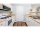 Modern kitchen with stainless steel appliances, white cabinets, and sleek countertops at 600 Bucksley Ln # 305, Charleston, SC 29492