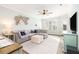 Bright living room with a large sectional couch, stylish decor, and a ceiling fan at 600 Bucksley Ln # 305, Charleston, SC 29492