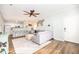 Open-concept living room with a modern kitchen, comfortable seating, and natural light at 600 Bucksley Ln # 305, Charleston, SC 29492
