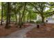 A walking path through the trees and green space at 600 Bucksley Ln # 305, Charleston, SC 29492