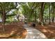 A wooden walking path through the trees and green space at 600 Bucksley Ln # 305, Charleston, SC 29492