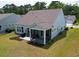 Aerial view of the backyard featuring a patio area with a grill and screened in porch at 6176 Wilkes Pond Dr, Hollywood, SC 29449
