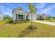Inviting home with landscaped front yard, charming details, and a well-maintained lawn at 6176 Wilkes Pond Dr, Hollywood, SC 29449