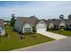 Well-maintained home with a spacious driveway, two-car garage and manicured front lawn at 6176 Wilkes Pond Dr, Hollywood, SC 29449