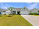 Charming single-Gathering home featuring a well-manicured lawn and a two-car garage at 6176 Wilkes Pond Dr, Hollywood, SC 29449