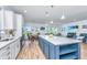 Open-concept kitchen with island, dining area, and seamless flow into the living space at 6176 Wilkes Pond Dr, Hollywood, SC 29449