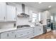 Modern kitchen featuring white cabinets, stainless steel appliances, and a gas cooktop at 6176 Wilkes Pond Dr, Hollywood, SC 29449