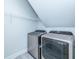 Laundry room featuring a front-load washer and dryer with wire rack shelving for storage at 6176 Wilkes Pond Dr, Hollywood, SC 29449