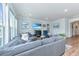 Comfortable living room featuring a large sectional sofa, modern decor, and plenty of natural light at 6176 Wilkes Pond Dr, Hollywood, SC 29449